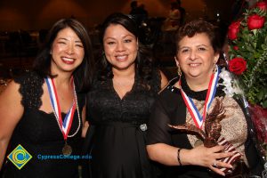 Three women enjoying the 40th Annual Americana Awards.
