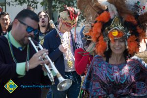 Gary Gopar playing the trumpet during Mardi Gras parade.