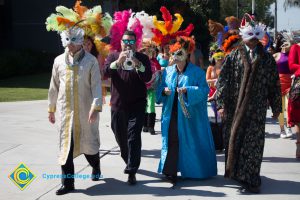 Masked participants of the Mardi Gras parade.