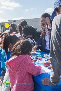 Children gathered at an activity table.