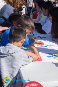 Children gathered at an activity table.