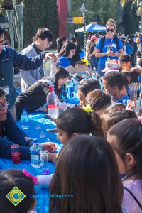 Children gathered at an activity table.