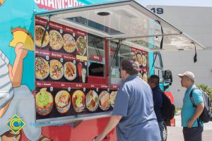 Students ordering from food trucks on campus.