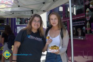 Students with their nachos from the food trucks.