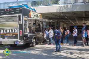 Students waiting in line at Berlin food truck on campus.