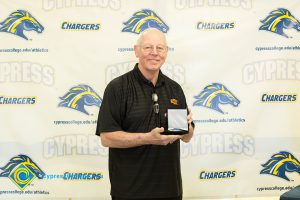 Man holding a medal.