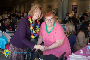 JoAnna Schilling with employee at end-of-the-year luau