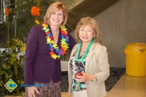 JoAnna Schilling with female employee at end-of-the-year luau