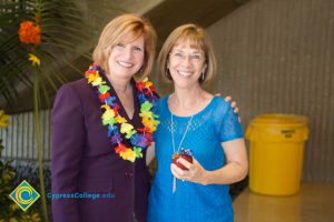 JoAnna Schilling with female employee at end-of-the-year luau