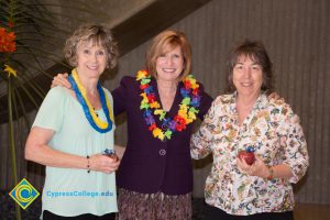 JoAnna Schilling with female employees at end-of-the-year luau