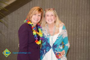 JoAnna Schilling with female employee at end-of-the-year luau