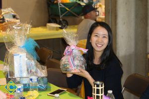 Raffle basket winner at end-of-the-year luau