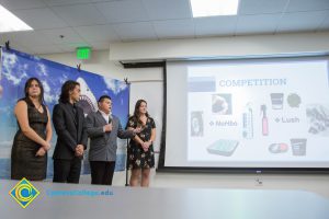 Group of four students presenting at the Fall 2018 Shark Tank.