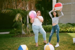 Students pose for selfie with multiple beach balls. Photo taken for Disposable Camera Project.