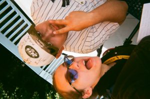 Students pose for selfies. Photo taken for Disposable Camera Project.