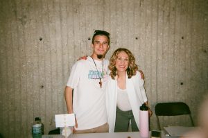 Student services workers at table. Photo taken for Disposable Camera Project.