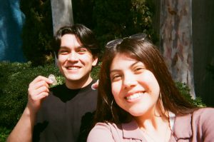 Students pose for selfie with coins. Photo taken for Disposable Camera Project.