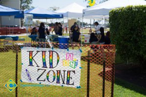 Kid Zone sign with rainbow letters.