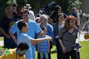 Spectators at the Cypress College 50th Anniversary Festival and Reunion talking and laughing.