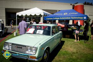 Vintage light green car on the lawn of Cypress College for the 50th Anniversary Festival and Reunion.