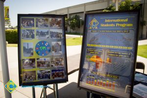 Two large glass displays on easels at the International Students booth.