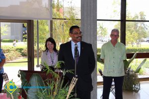 Speaker Santanu Bandyopadhyay with President Bob Simpson and another woman standing behind him.