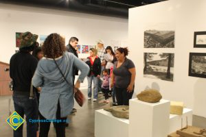 People standing in an art gallery.