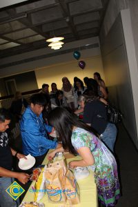 Students serving themselves food at the ESL potluck.