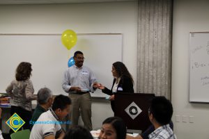 Santanu Bandyopadhyay and two staff members at the 2014 ESL Scholarship Potluck