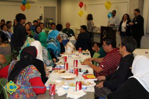 Students enjoying the 2014 ESL Scholarship Potluck.