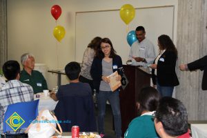 Students enjoying the 2014 ESL Scholarship Potluck.