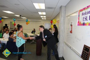 Student receiving award at 2014 ESL Potluck.