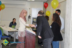 Student receiving award at 2014 ESL Potluck.