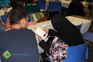 Students looking through a book.