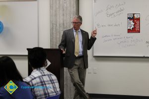 President Bob Simpson speaking to students at the ESL Scholarship Potluck.