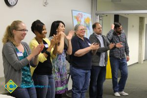 Group of people applauding.