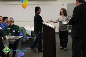 Student and staff at the 2014 ESL Potluck.