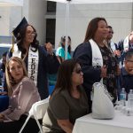 EOPS graduation reception with students and guests seated and standing at tables.