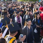 Graduating students walking the commencement processional.