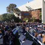 View of graduates seated during commencement.