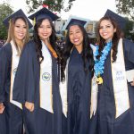 A group of graduates smiling.