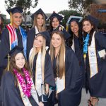 A group of graduates smiling.