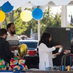 Vendors selling graduation gifts.