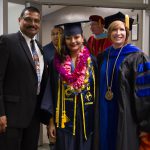 Dr. Shilling and VPI Santanu Bandyopadhyay with a female STEM graduate in her cap and gown,