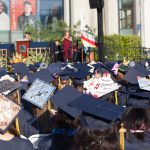 View of graduation caps during commencement.