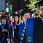 Students walking the commencement processional.