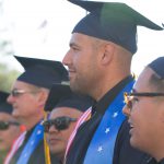 Students in their cap and gown during commencement ceremony.