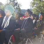 Cypress College graduates seated and focused on the commencement ceremony,