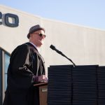 Professor Bryan Seiling speaking at commencement ceremony.