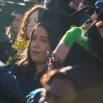 Cypress College graduates seated and focused on the commencement ceremony,